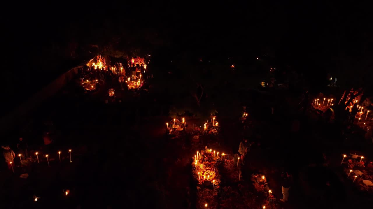 DRONE : DOLLY IN SHOT OF PATZCUARO GRAVEYARD AT DIA DE MUERTOS IN MICHOACAN