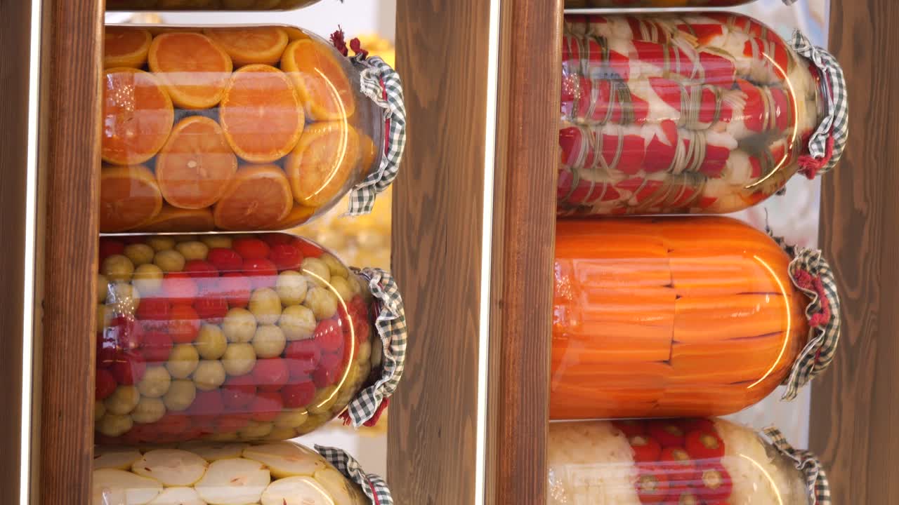 Jars of Pickled Fruits and Vegetables on Shelves