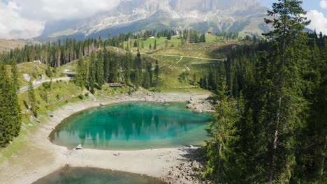 Reveal-shot-from-the-trees-of-the-beautiful-Lago-di-Carezza