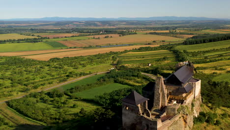 revealing cinematic drone shot of the boldogkő castle in hungary