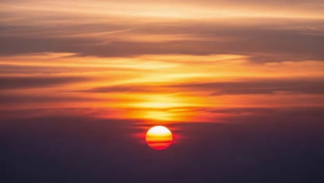 a vibrant sunset paints the sky with warm orange and red hues