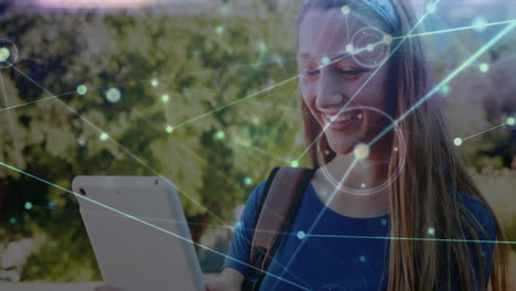 smiling girl using tablet, network connections and data processing animation over