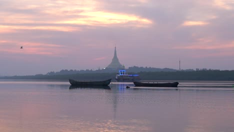 Ferry-Boat-sailing-at-The-Arabian-Sea-With-The-Famous-Global-Vipassana-Pagoda-During-Sunset-In-Mumbai,-India