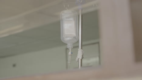 medium shot of a transparent medical infuse in a hospital in africa with medicine inside of it log