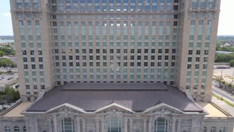 entrance and front facade of recently restored michigan central station building in corktown neighborhood