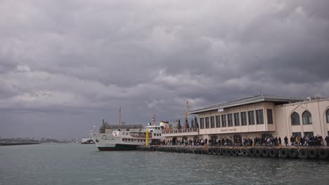 At-the-Kadıköy-pier,-in-cloudy-weather,-ships-are-sailing,-birds-are-flying,-on-the-Bosphorus