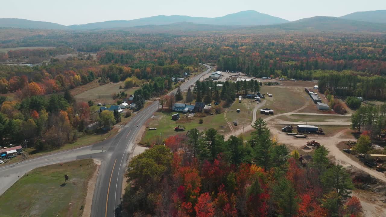 Autumn Drone Sweep Over Phillips, Maine - Winding Road, Forest and Mountains