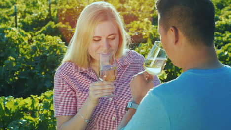 couple in love tasting wine in the vineyard wine tour