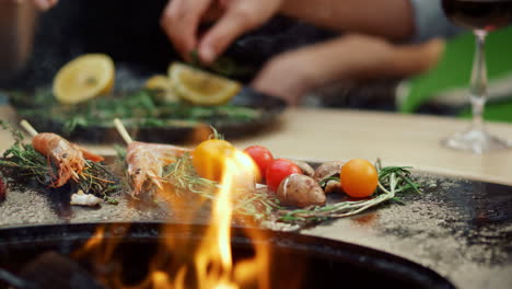 Vegetables-and-sea-food-cooking-for-bbq-party.-Food-browning-on-backyard