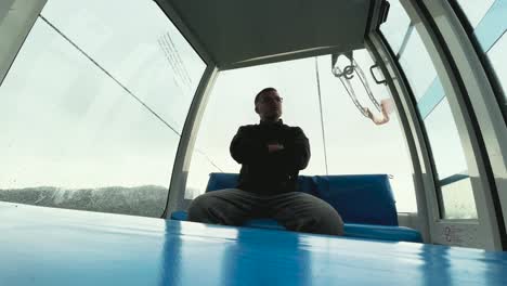 a man rides alone in a gondola