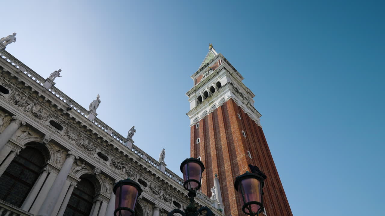 St Mark's Campanile Bell Tower Against Blue Clear Sky In Venice, Italy - low angle