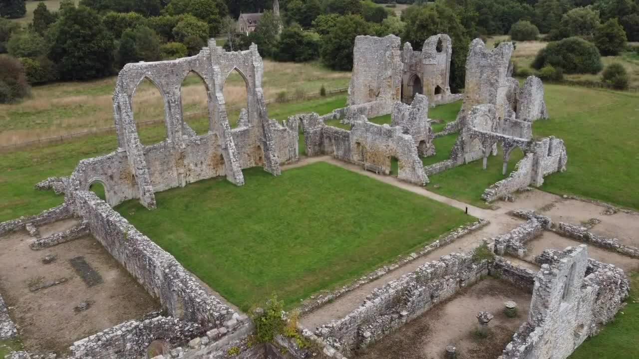 Aerial drone shot of Old Bayham Abbey, Kent. Rising view from above reveals the historic ruins and surrounding lush countryside, perfect for travel, history, or cinematic projects