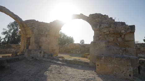 beautiful scenic footage as the sun shines through the archway of an ancient greek castle