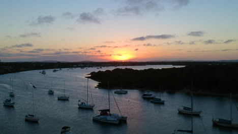 beautiful sunset of boats on a river