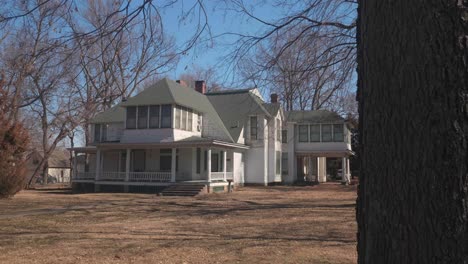 large two-story white house with porch
