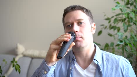 man singing karaoke at home. close-up view.