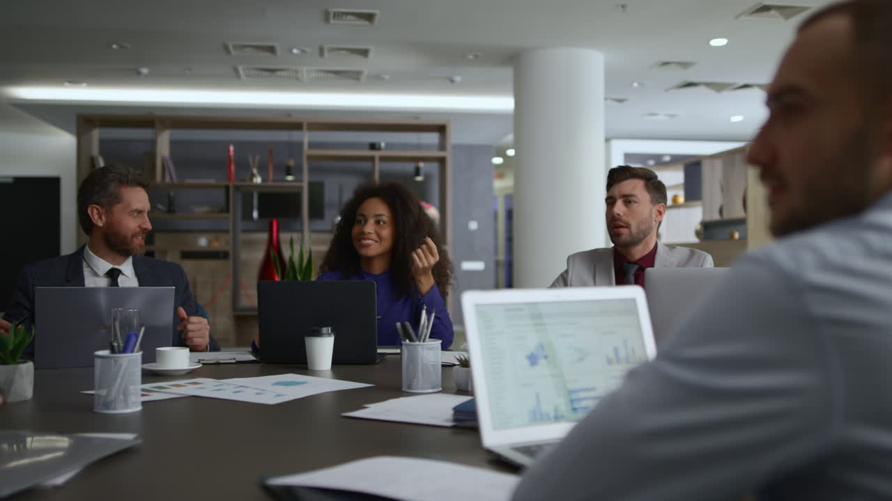 Diverse coworkers group talking