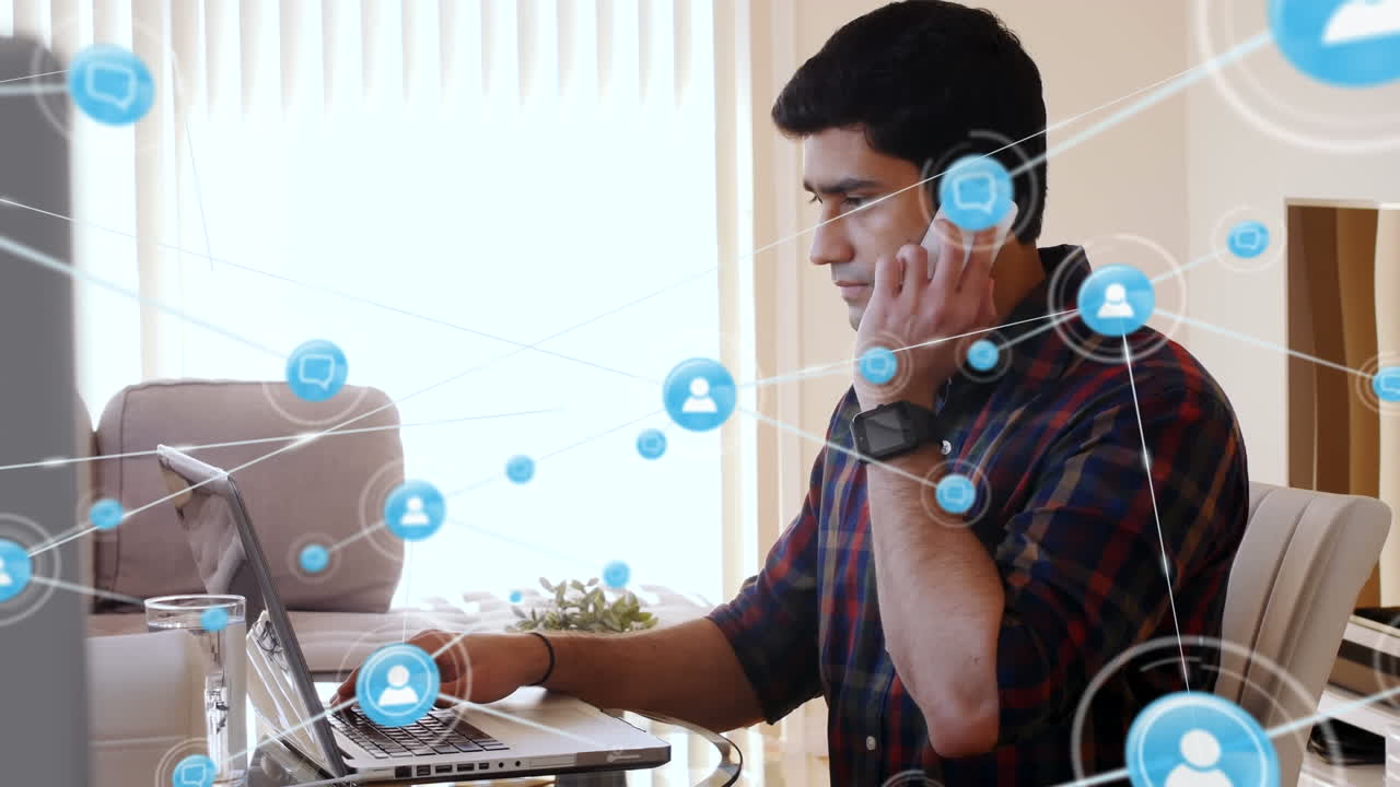 animación de iconos conectados sobre hombre asiático trabajando en una computadora portátil y hablando en teléfono celular