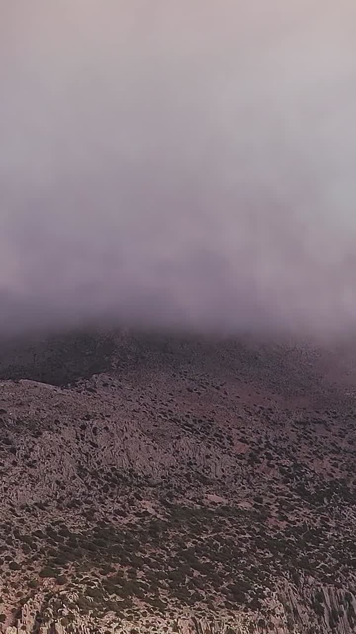 Clouds cover Malaga mountains during late afternoon in Spain