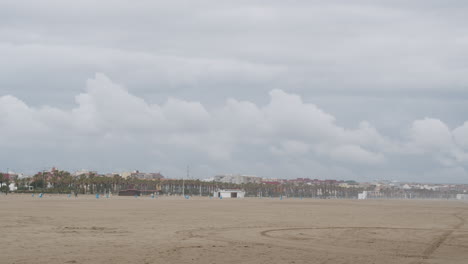 panorama of city beach in valencia and rough sea spain