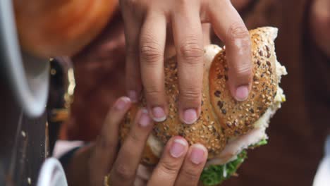 hand holding a sandwich