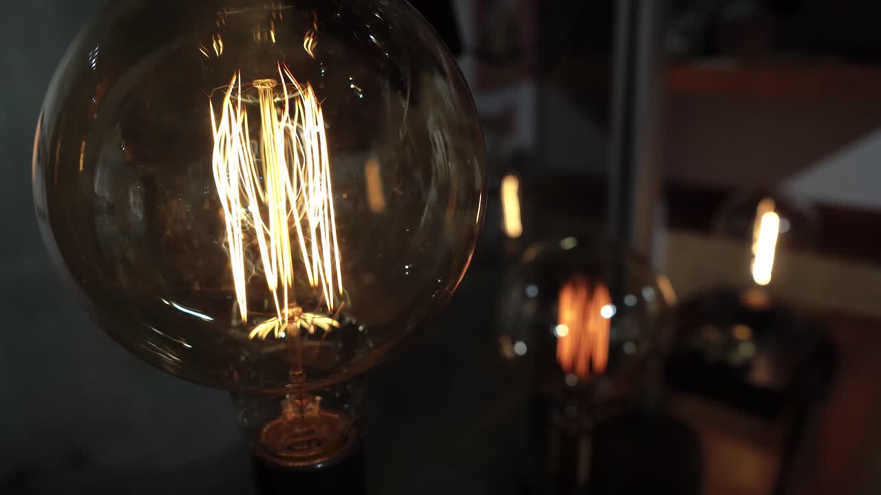 Vintage incadescent light bulbs by window sill.