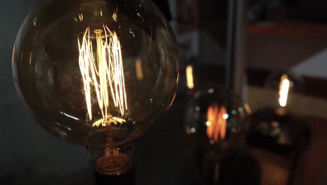 vintage incadescent light bulbs by window sill.