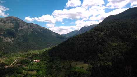 aerial motion lapse above green mountains surrounding lake tsivlou in peloponnese greece