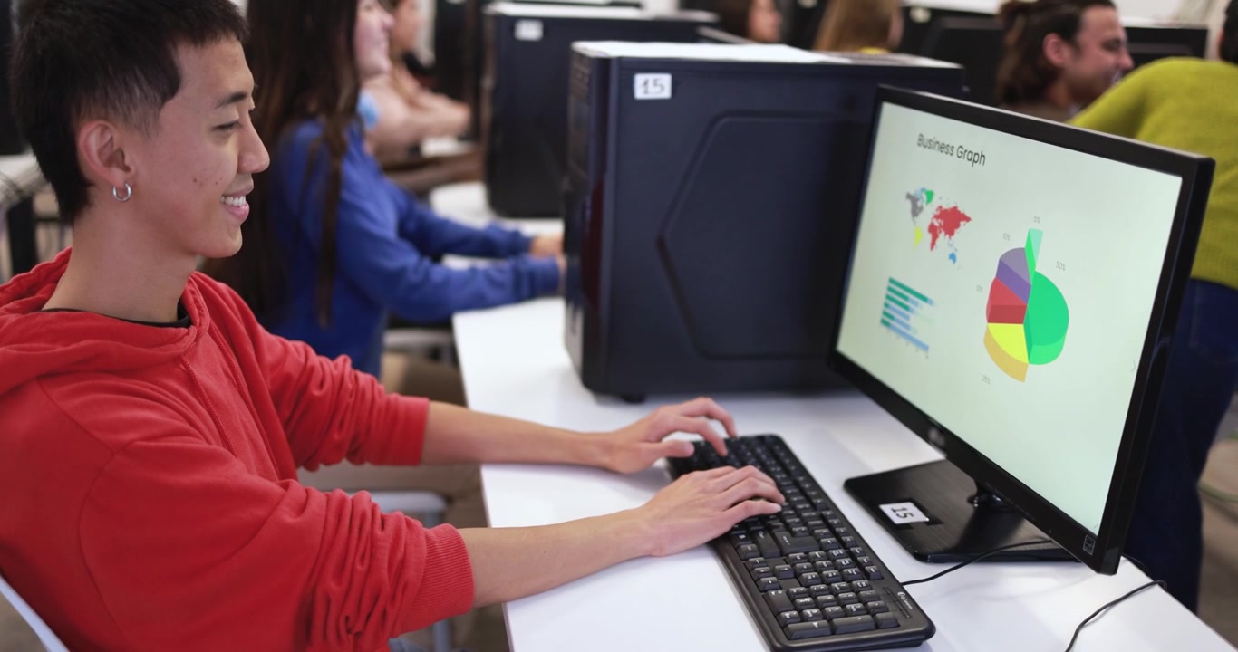 Young Man Working on Computer in Classroom