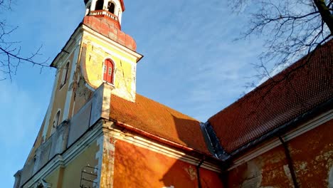 pan up from door to steeple of st
