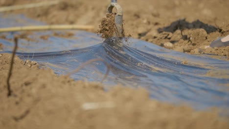 Slow-Motion-Shot-Of-Machine-Preparing-Dry-Terrain-For-Plantation