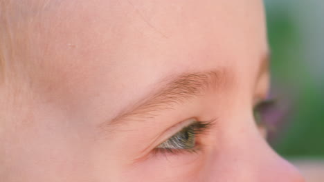 close up, side view portrait of a smiling little girl