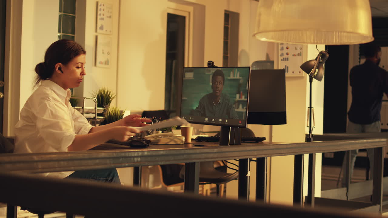 Female employee talking on online webcam conference