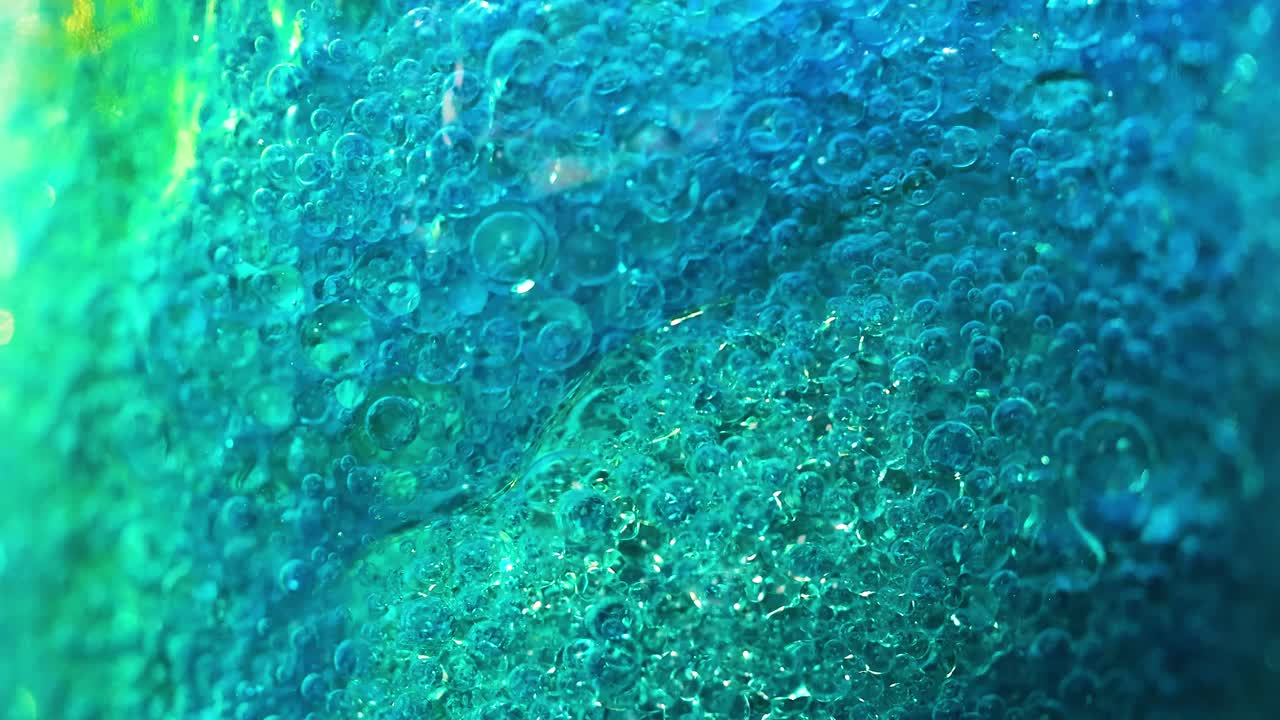líquido burbujeante de colores y texturas vibrantes