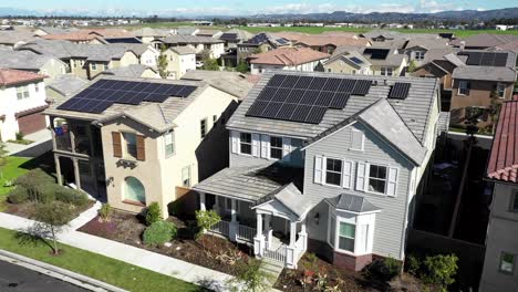 Aerial-over-community-of-house,-solar-on-rooftop-homes-in-Tustin,-CA,-clean-energy