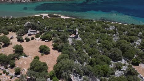 Aerial-view-of-ancient-Lykia-ruins,-Aperlai-Ancient-City,-on-the-coast-of-Turkey-along-Lycian-Way-hiking-trail