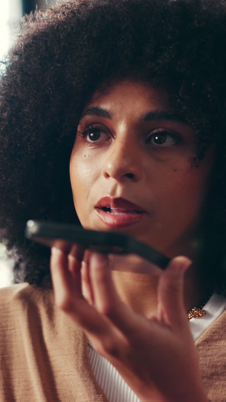Woman with Afro Talking on Phone