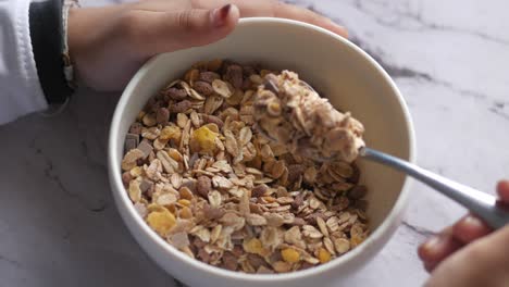 child eating granola