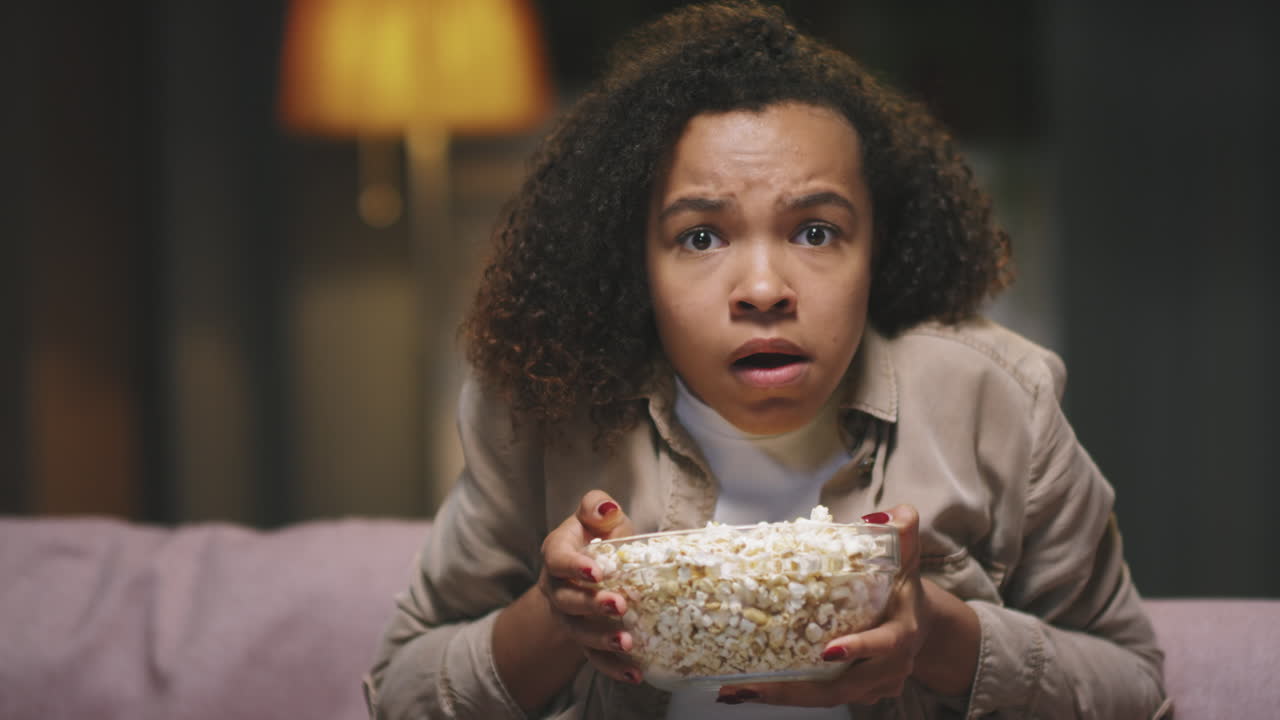 POV Of Afro Girl Watching Horror Movie