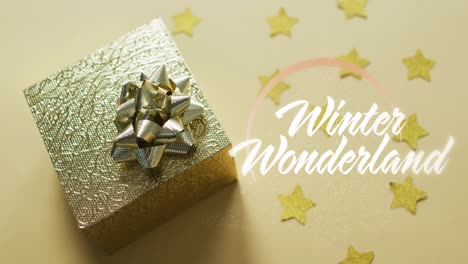 animation of winter wonderland text over christmas gift
