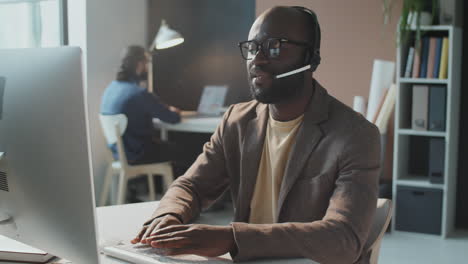 man working with client online