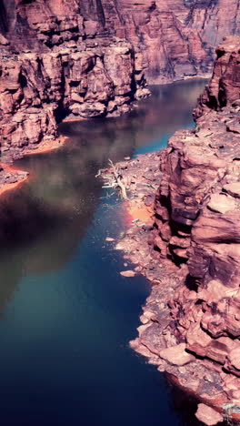 aerial view of a river cutting through a red rock canyon