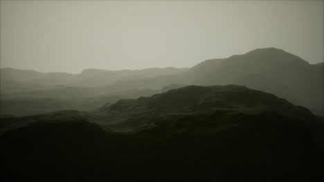 rocks and mountains in deep fog