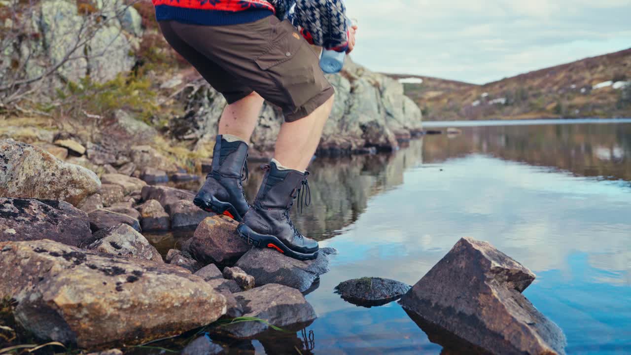 Man Drinking Water From Clean River In Norway - Close Up