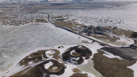 Aerial-View-of-Myvatn-Lake-and-Volcanic-Craters-on-Winter-Season,-Frozen-Water-and-Landscape-of-Iceland