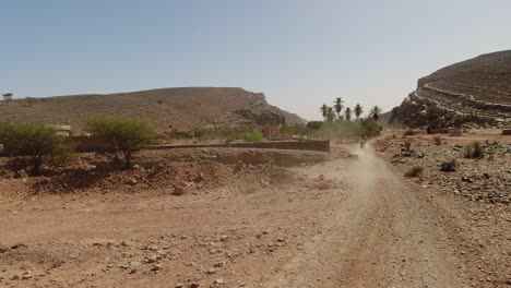 Point-Of-View-of-a-motorcycle-driver-following-rally-motorcycles-in-the-desert