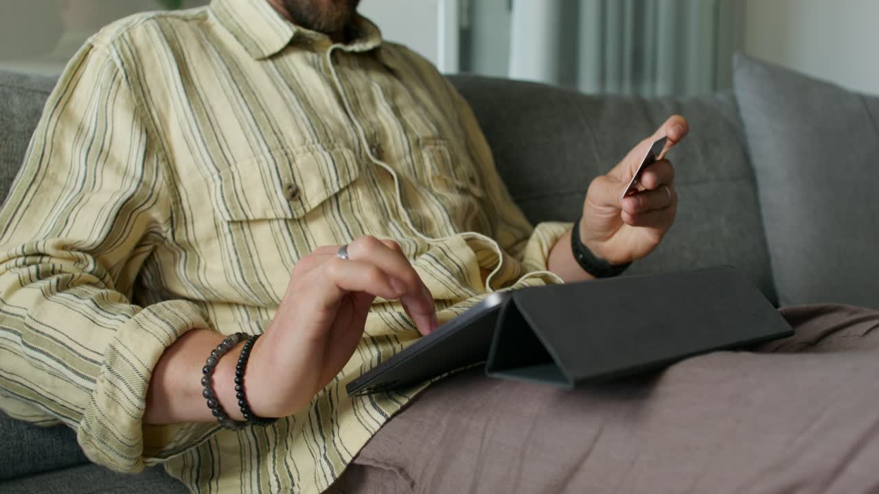 Man making an online purchase on a tablet