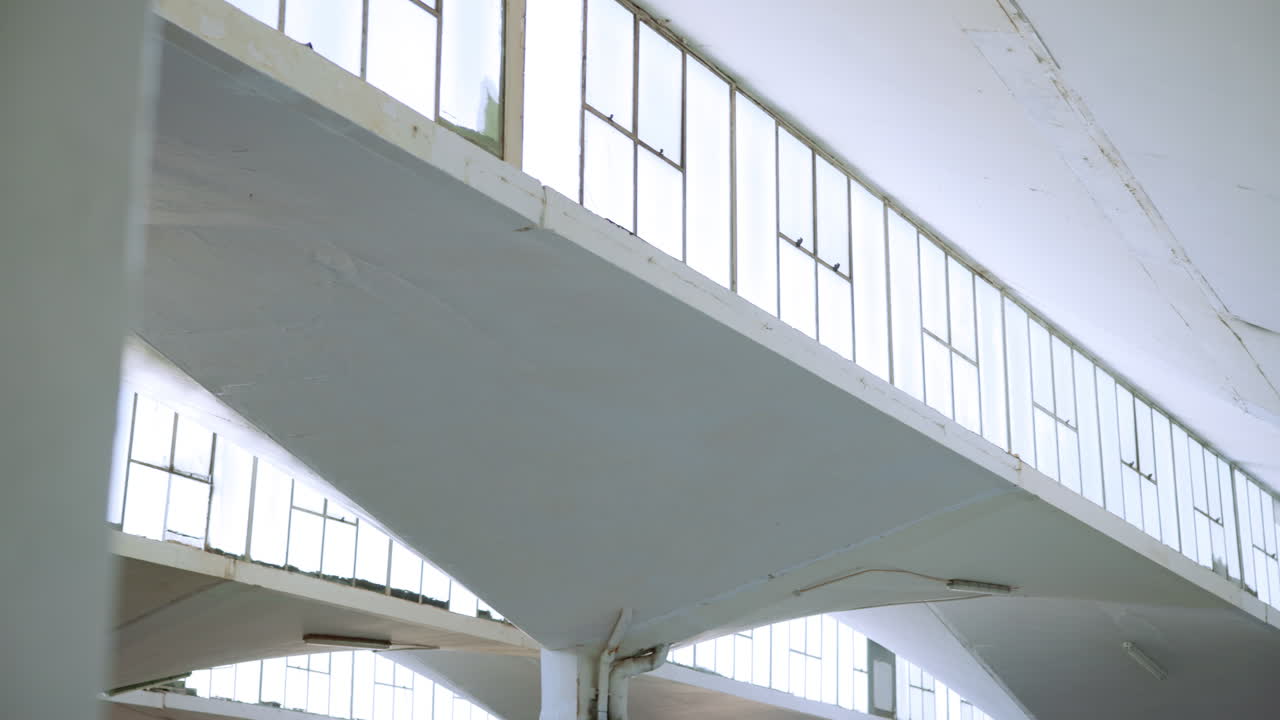 Architectural Interior with Concrete Support Beams and Windows