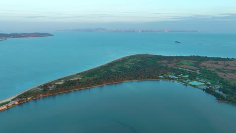 drone flight over kinmen island, 金門, quemoy, and chinese coastline with skyline in background at sunrise in asia