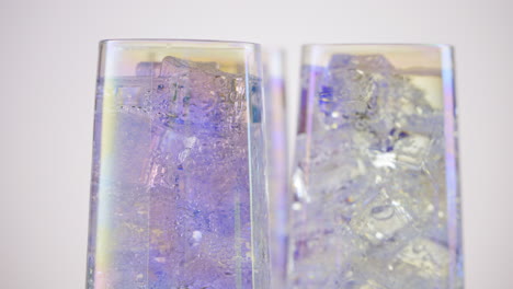 soda drinks with ice cubes and bubbles rotating